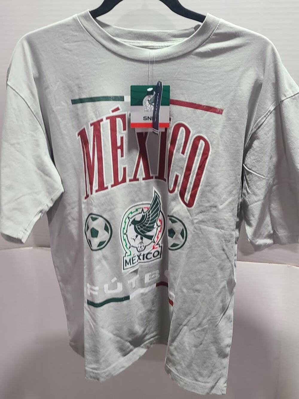 light gray t-shirt is a Mexico Soccer graphic tee featuring the national t